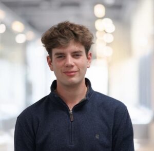 An image of student Nicholas Stella, a young man wearing a blue sweater.